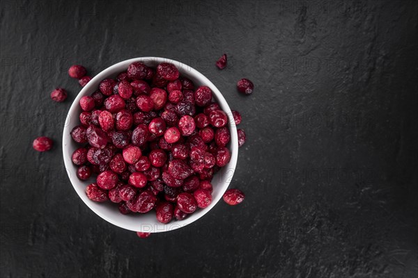Portion of healthy Dried Cranberries (selective focus, close-up shot)
