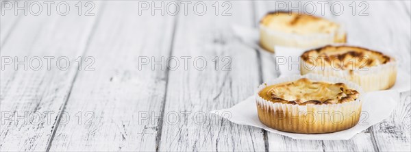 Fresh made Mini Cheesecake on a vintage background (close-up shot)
