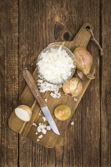 Diced white onions on a vintage background as detailed close-up shot, selective focus