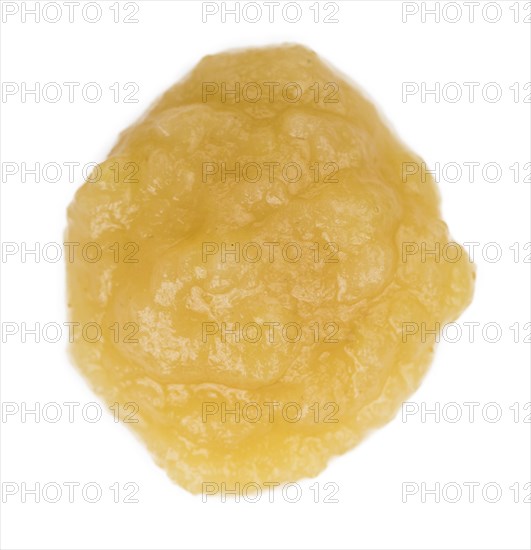 Portion of homemade Applesauce (selective focus) isolated on white background (close-up shot)
