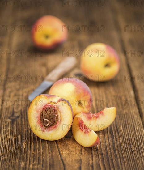 Peaches on a vintage background as detailed close-up shot, selective focus