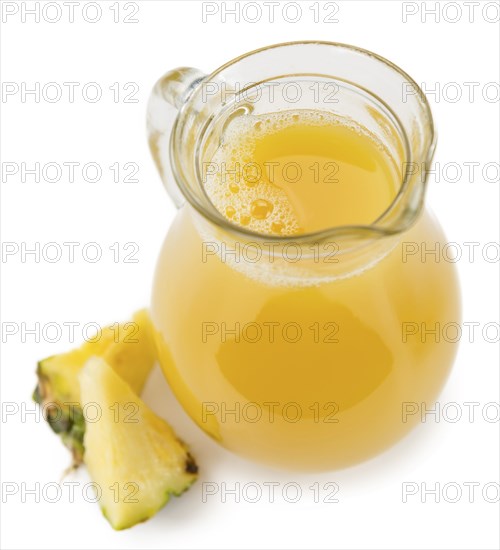 Portion of Pineapple Juice as detailed close-up shot isolated on white background