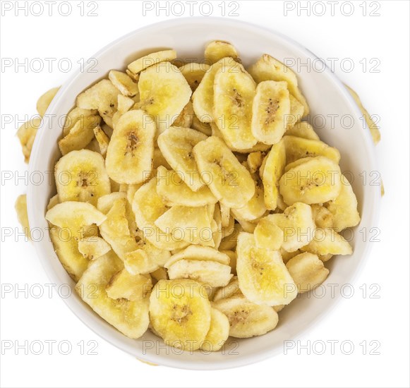 Fresh made Dried Banana Chips isolated on white background, close-up shot