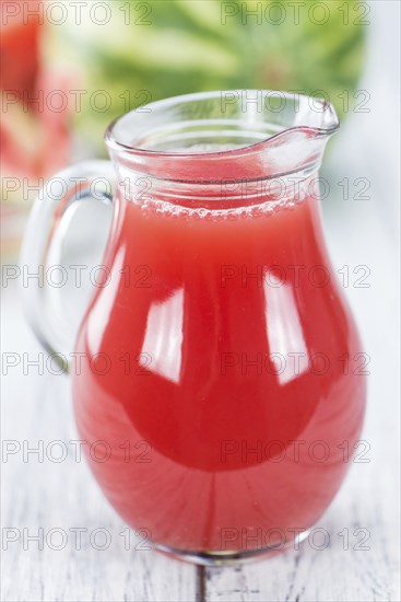 Watermelon Smoothie on a vintage background as detailed close-up shot (selective focus)