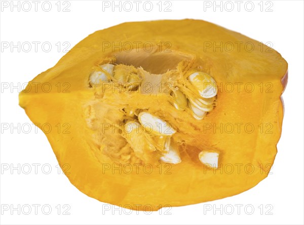 Portion of fesh Pumpkin (close-up shot) isolated on a white background