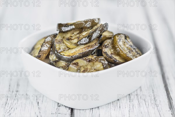 Homemade Antipasti (Grilled Zucchinis) on vintage background (selective focus, close-up shot)