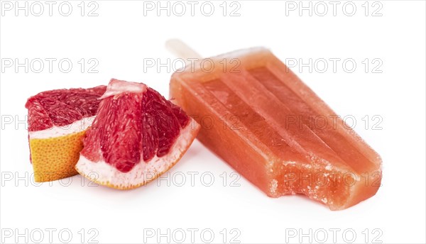 Portion of homemade Grapefruit Popsicles isolated on white background (selective focus)