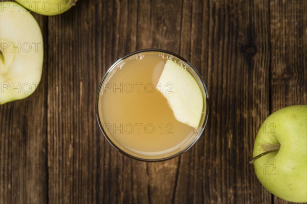 Fresh made Juice (apple) on a vintage background (close-up shot)