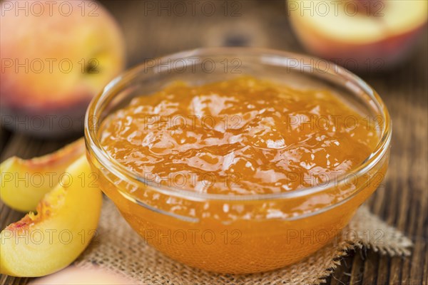 Peach Jam on a vintage background as detailed close-up shot, selective focus