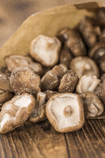 Portion of fresh Shiitake mushrooms close-up shot, selective focus
