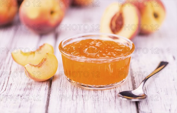 Peach Jam on a vintage background as detailed close-up shot, selective focus