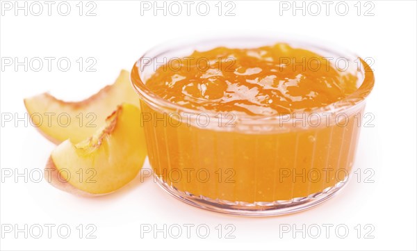 Peach Jam on a vintage slate slab as detailed close-up shot, selective focus