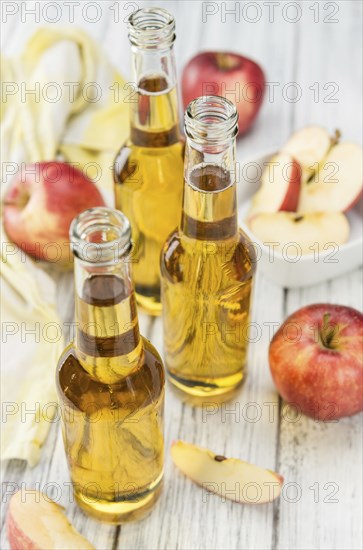 Apple Cider on a vintage background as detailed close-up shot (selective focus)