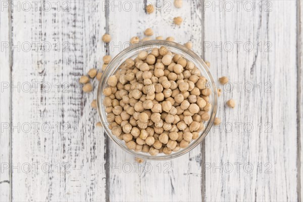 Chickpeas on a vintage background as detailed close-up shot, selective focus