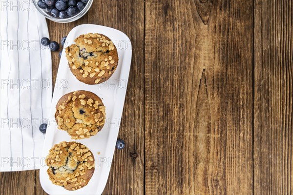 Fresh Blueberry Muffins as detailed close-up shot (selective focus)