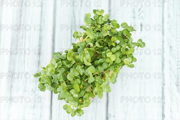Cress on a vintage background as detailed close-up shot (selective focus)