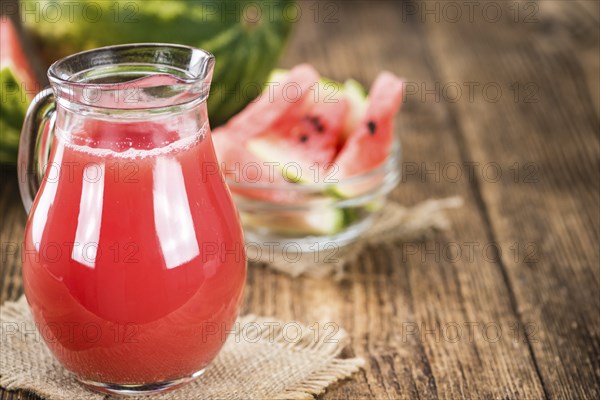 Watermelon Smoothie on a vintage background as detailed close-up shot (selective focus)