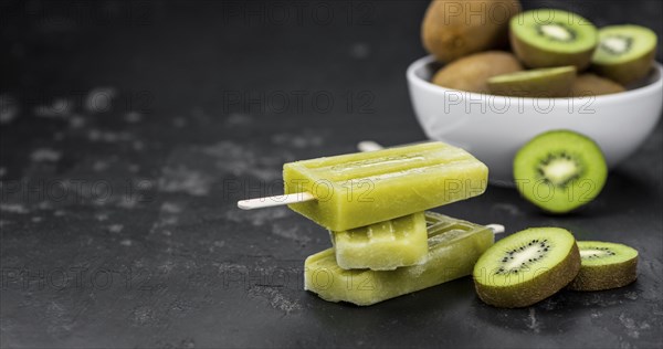 Kiwi Popsicles (fresh) as detailed close-up shot, selective focus)