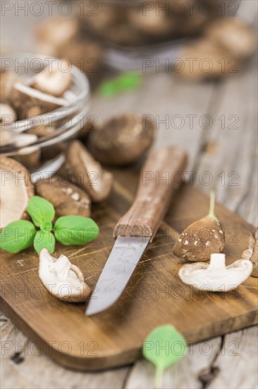 Portion of fresh Shiitake mushrooms close-up shot, selective focus
