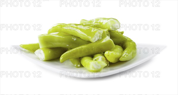 Pimientos (filled with cream cheese) isolated on white background (selective focus, close-up shot)