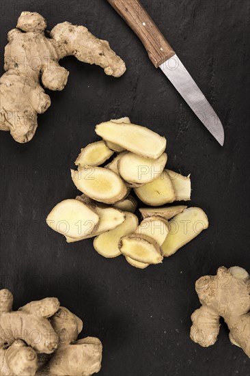 Slate slab with Ginger Slices (selective focus, close-up shot)