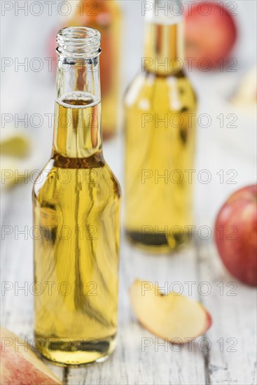 Apple Cider on a vintage background as detailed close-up shot (selective focus)