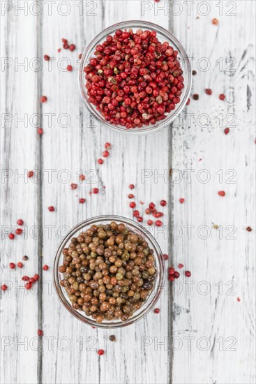 Portion of fresh preserved Pink Peppercorns close-up shot, selective focus