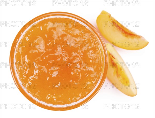 Portion of Peach Jam on a rustic slate slab, selective focus, close-up shot