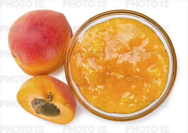 Portion of fresh made Apricot Jam isolated on white background