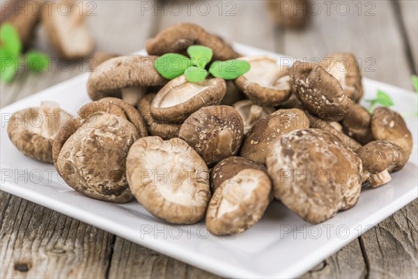 Portion of fresh Shiitake mushrooms close-up shot, selective focus