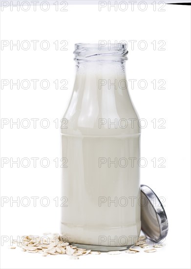 Oat Milk isolated on white background (selective focus, close-up shot)