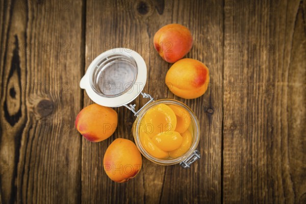 Pickled Apricots on a vintage background as detailed close-up shot (selective focus)