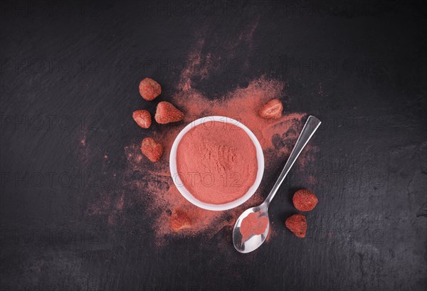 Some Instant Strawberries on a vintage slate slab, selective focus