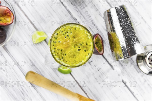 Vintage wooden table with Jorge Amado Cocktail (selective focus, close-up shot)