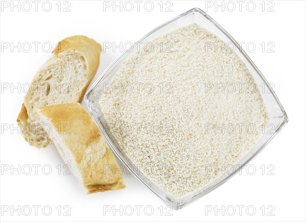 Breadcrumbs as detailed close-up shot isolated on white background (selective focus)