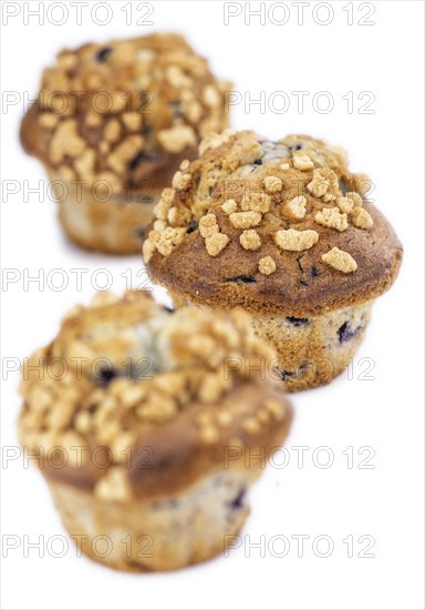 Blueberry Muffins isolated on white background (selective focus, close-up shot)