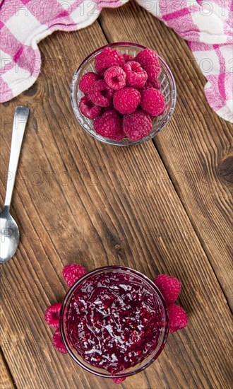 Fresh made Raspberry Jam on a vintage background as detailed close-up shot