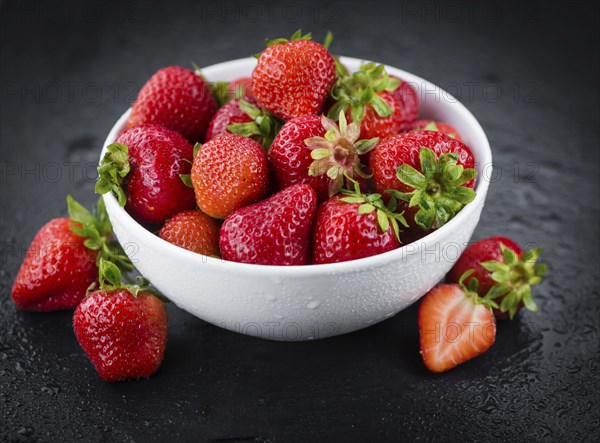 Strawberries on a vintage background as detailed close-up shot, selective focus