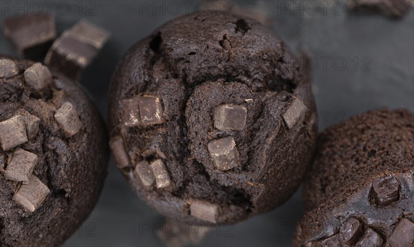 Fresh Chocolate Muffins as detailed close-up shot (selective focus)