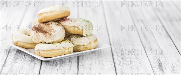 Portion of some Donuts as detailed close-up shot (fresh made, selective focus)