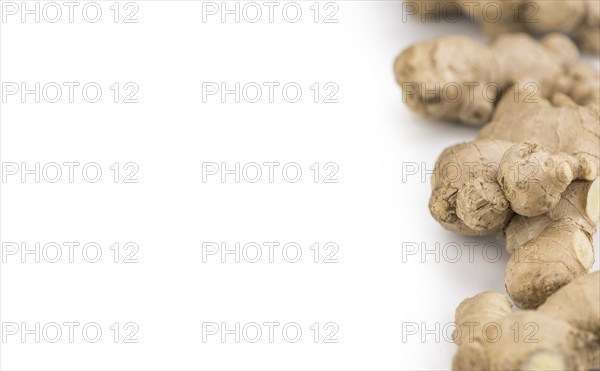 Ginger Slices isolated on white background (selective focus, close-up shot)