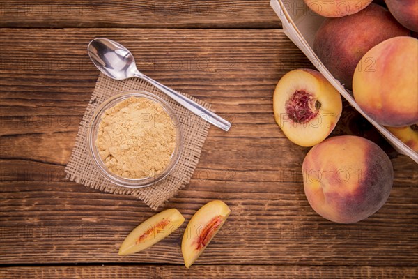 Ground Peaches on a vintage background as detailed close-up shot, selective focus