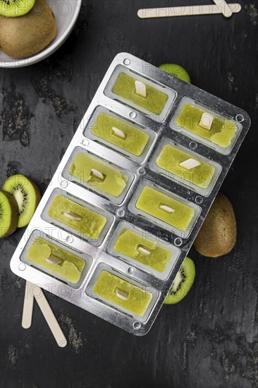 Kiwi Popsicles (fresh) as detailed close-up shot, selective focus)