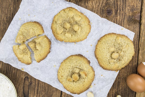 Wooden table with Cookies (detailed close-up shot, selective focus)
