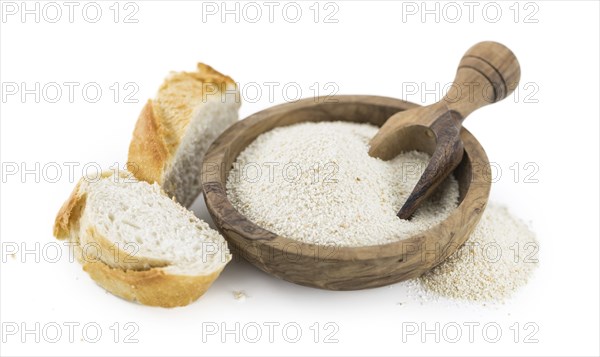 Bread Crumbs isolated on white background (selective focus, close-up shot)