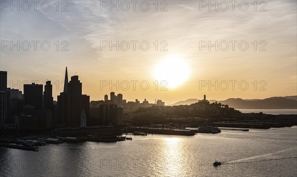 San Francisco Downtown at sunset. View from Oakland Bay Bridge