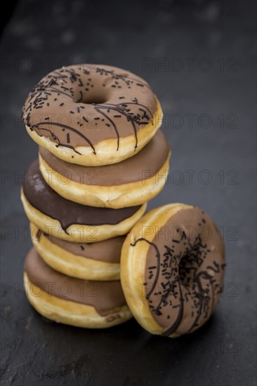 Portion of some Donuts as detailed close-up shot (fresh made, selective focus)