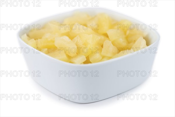 Portion of Preserved Pineapple pieces as detailed close-up shot isolated on white background