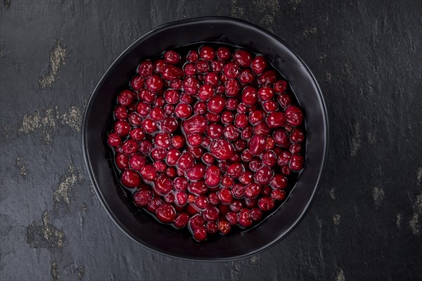 Portion of healthy Cranberries (preserved) (selective focus, close-up shot)