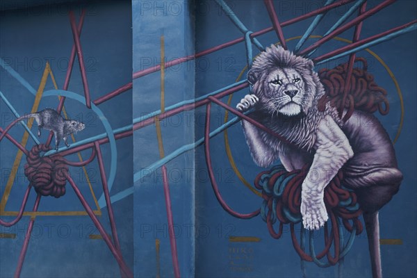 Lion and mouse hanging in ropes, mural by Greek street artist Nikolaos Tsounakas, Psirri